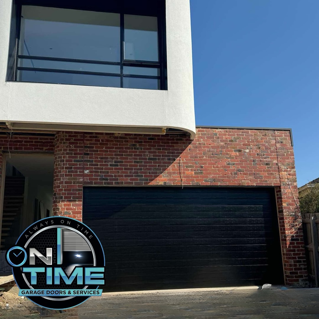 Black sectional garage door installation